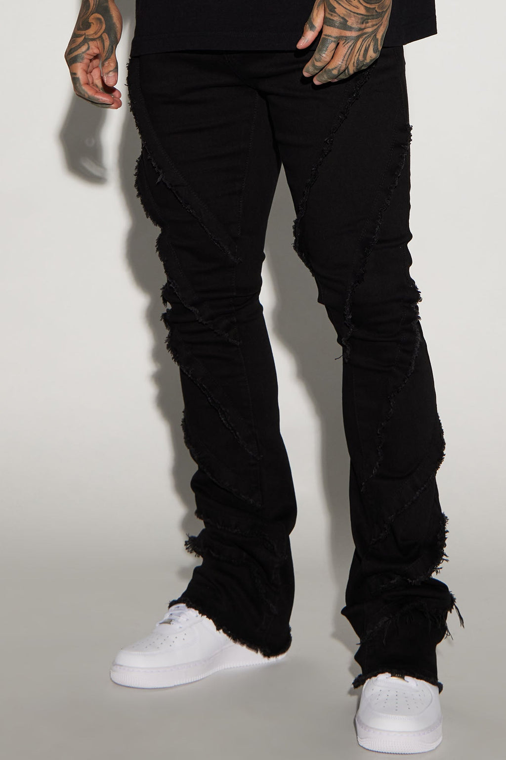 Slanted Fray Stacked Skinny Flare Jeans - Black image 1