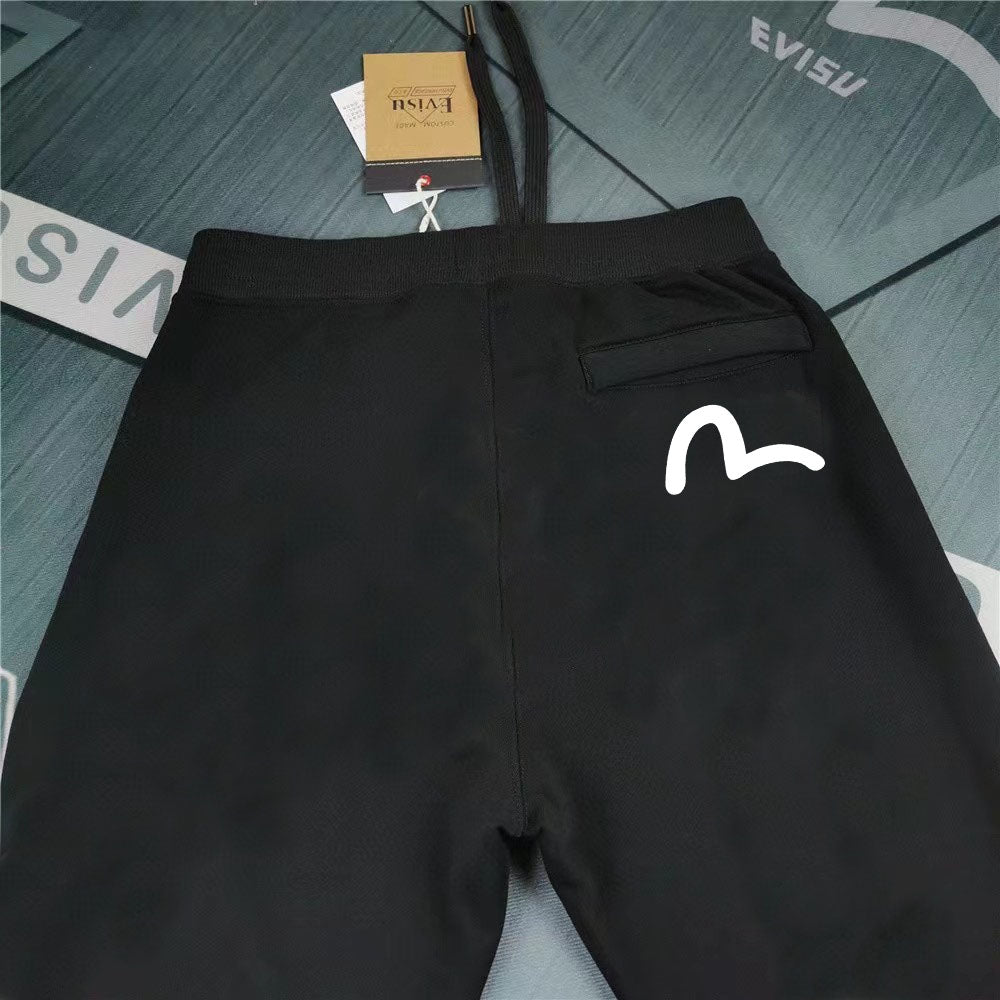 Evisu Kuro Daruma Face Jogger Sweatpants — Line-Art Front & Oversized M-Seagull Back