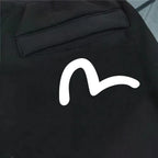Evisu Kuro Daruma Face Jogger Sweatpants — Line-Art Front & Oversized M-Seagull Back