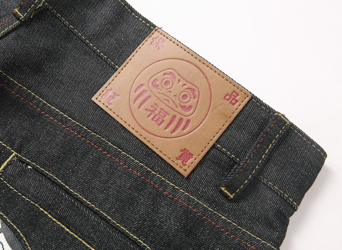 EVISU KURO Daicock Daruma Doll Print Appliqué Panel Jeans Wide Fit Raw Selvedge Dark Indigo